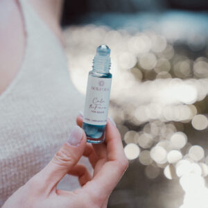 Bella Oils Calm the Farm essential oil roller used as part of a grounding routine to support relaxation and nervous system wellbeing.