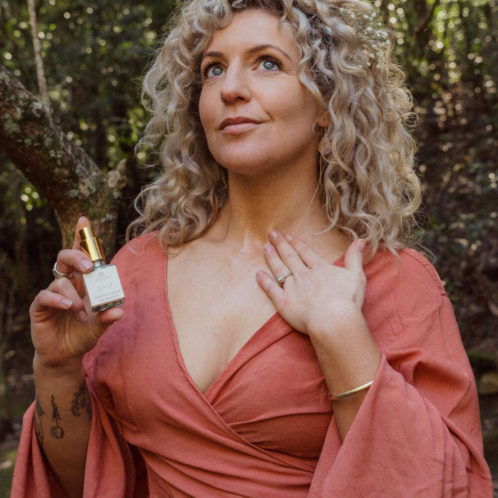 Wearing Bella Oils Heart natural alcohol-free perfume with a soft romantic rose and floral fragrance.